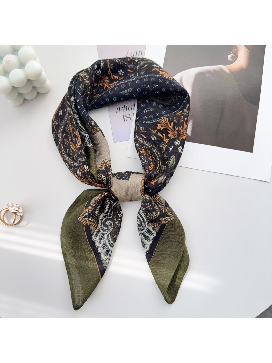 Army Green paisley scarf tied around a display bust