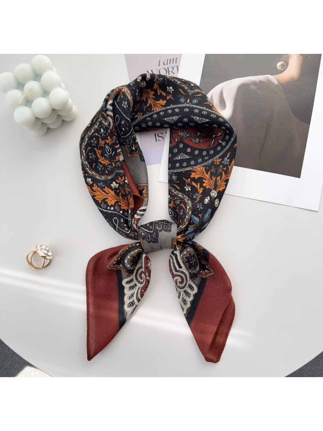 Red paisley scarf tied around a display bust