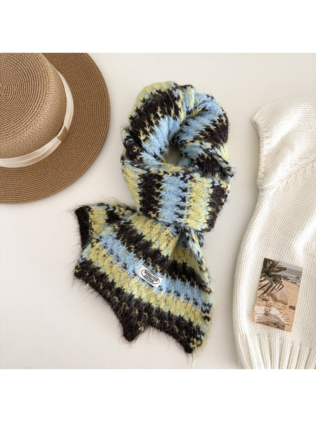 Navy striped scarf on a white display form