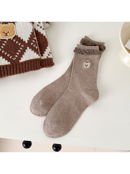 Light Coffee ribbed bear-motif socks with braided cuff trim.