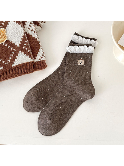 Dark Coffee ribbed bear-motif socks with small contrasting dots and white braided cuff trim.
