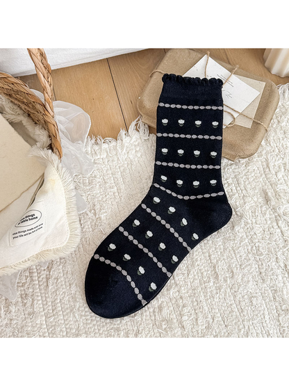 Black Flower crew sock with small flower motifs and a scalloped cuff