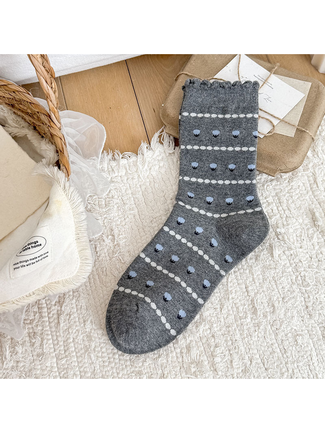 Gray Flower crew sock with small flower motifs and a scalloped cuff