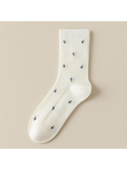 White ribbed crew socks with multicolor motifs