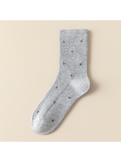 Light gray ribbed crew socks with multicolor motifs