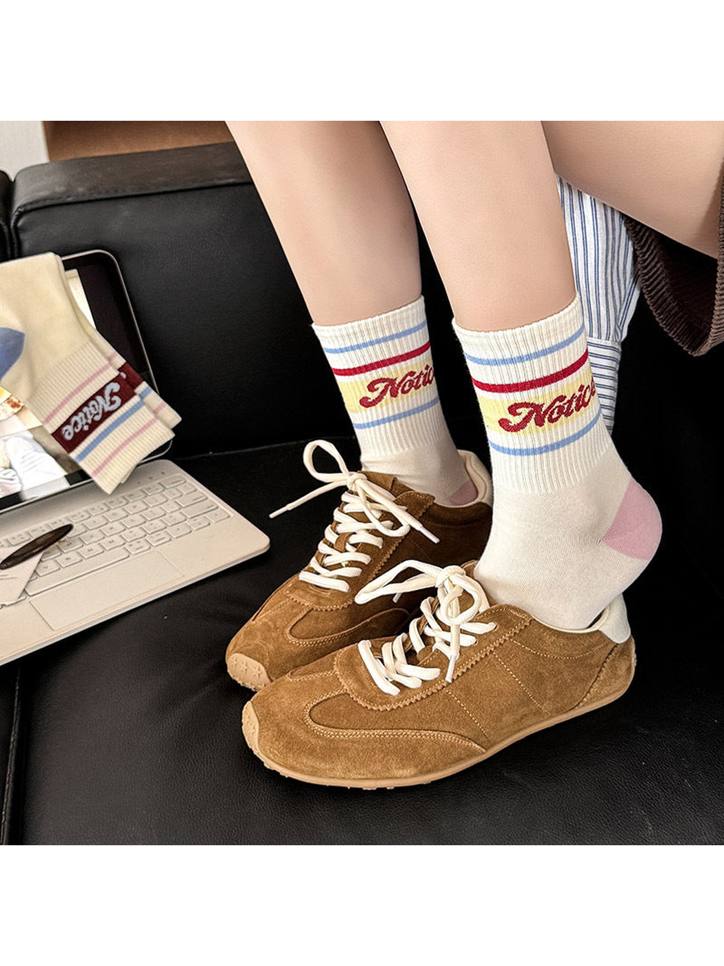 Pink-heel crew socks worn with brown sneakers