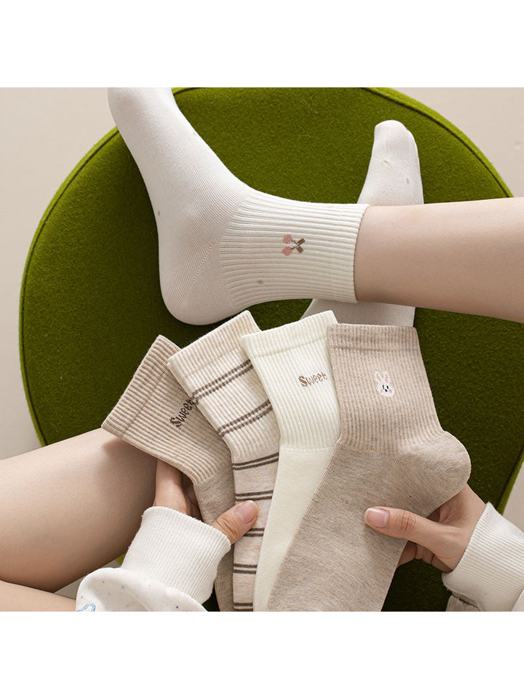 Neutral crew socks held together with one sock worn on a foot