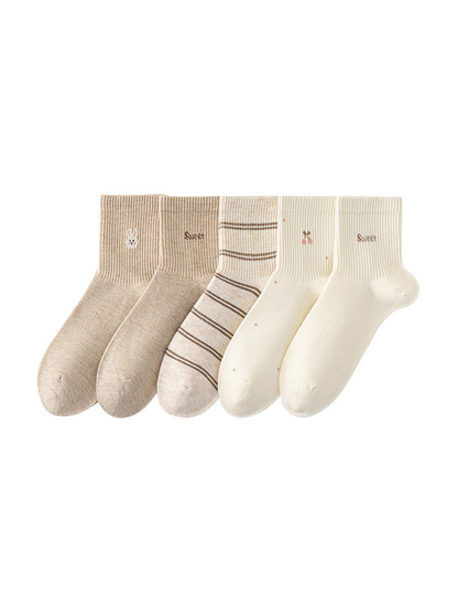 Five neutral crew socks displayed together on a white background