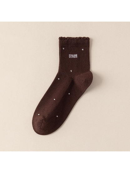 Coffee crew sock with scattered dot motifs and a scalloped ribbed cuff