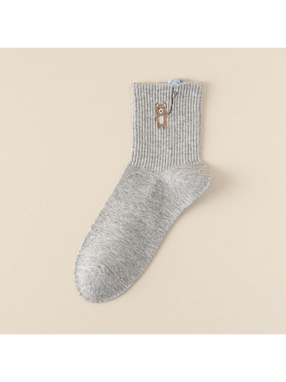 Balloon style light gray crew sock with a bear motif and blue balloon detail above the ribbed cuff