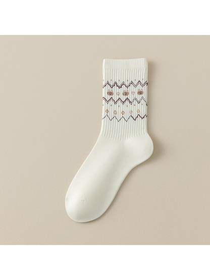 Zigzag crew sock with brown geometric bands across the ribbed leg