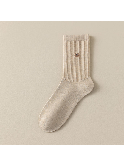 Mottled crew sock with a ribbed leg and a small cat motif
