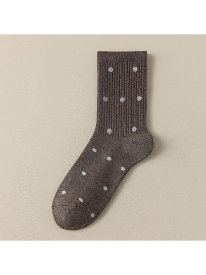 Dots crew sock with pale polka dots across the ribbed leg and foot