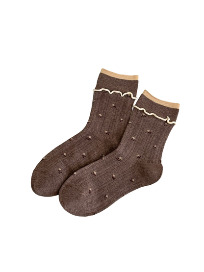 Coffee floral socks with light contrasting cuff edging, vertical ribbing, and wavy trim