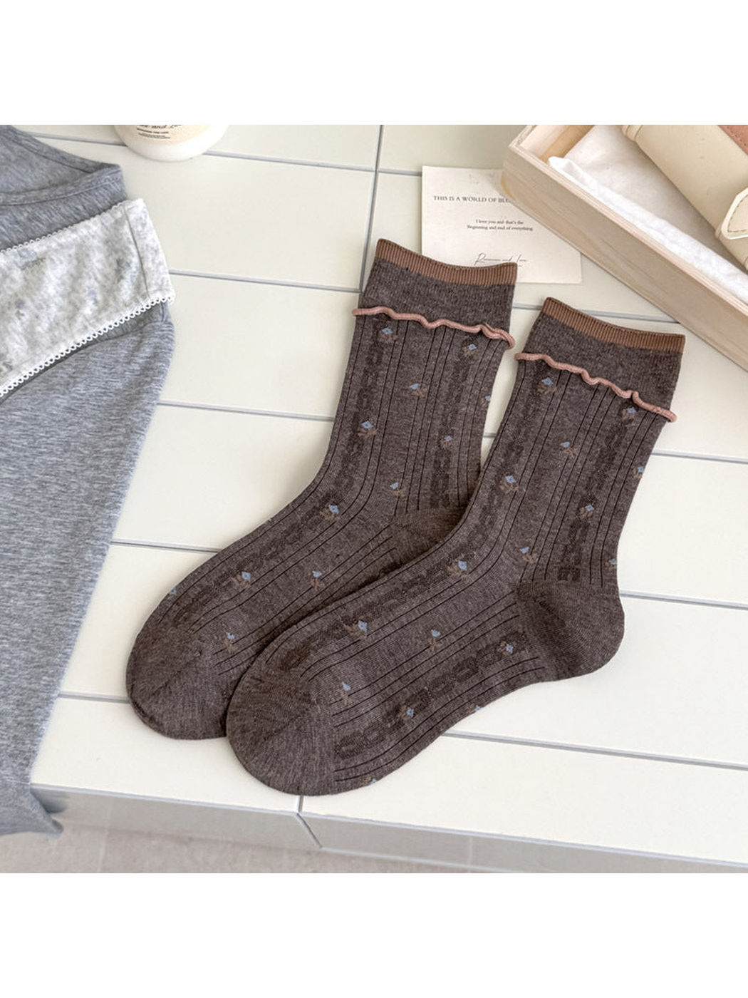 Dark Coffee floral socks with brown cuff edging, vertical ribbing, and pink wavy trim
