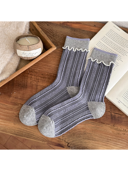Light Gray socks with pale lavender vertical stripes, contrasting toe and heel panels, and white wavy cuff trim