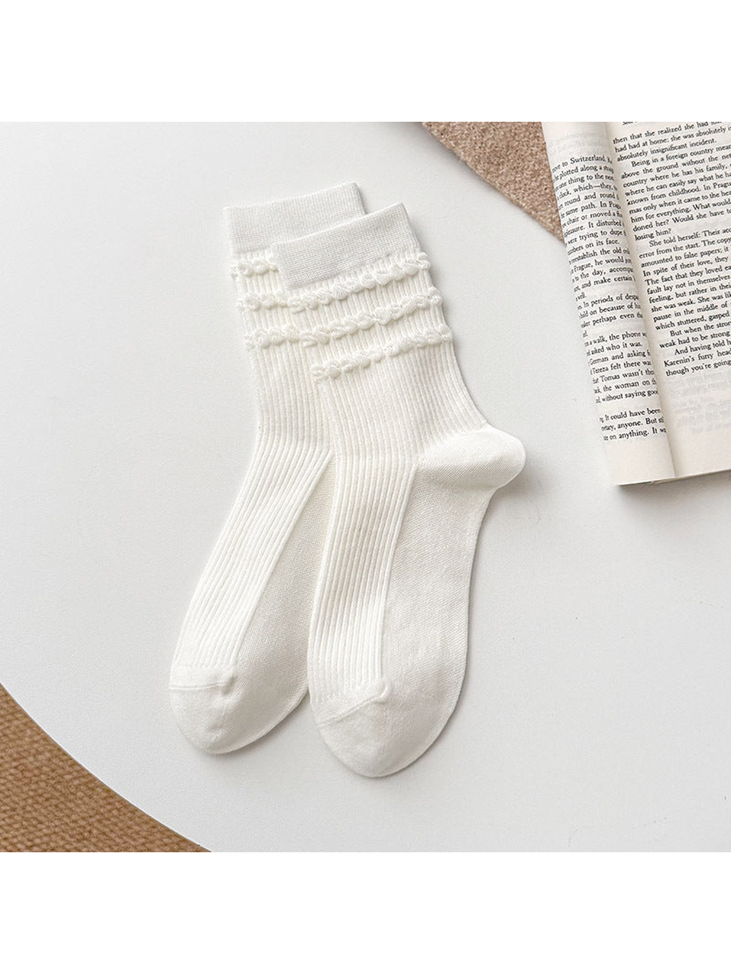 White Triple Ruffle socks with vertical ribbing and three ruffled rows below straight cuffs.
