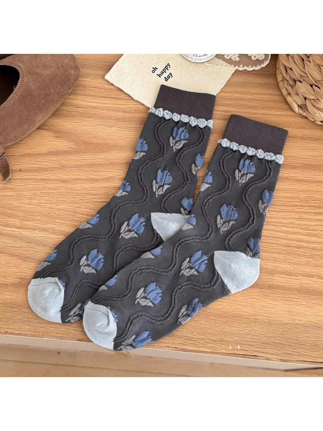 Dark Gray crew socks with blue tulip motifs, raised wavy lines, and pale blue-gray heel and toe panels.