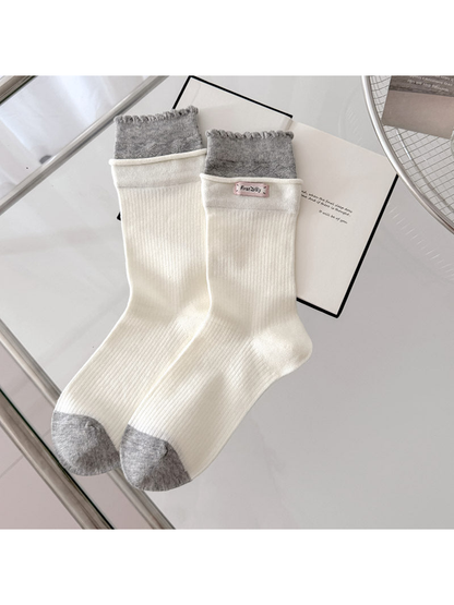 Ivory ribbed socks with gray scalloped cuffs and contrasting gray toes