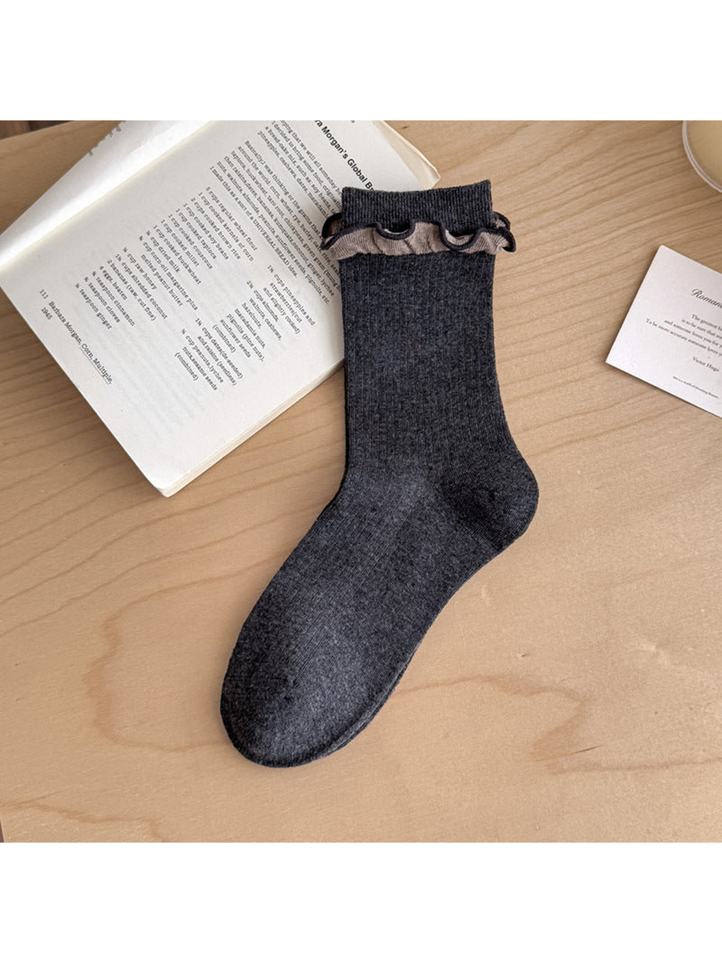 Dark Gray ribbed sock with contrasting taupe ruffled trim below the cuff.
