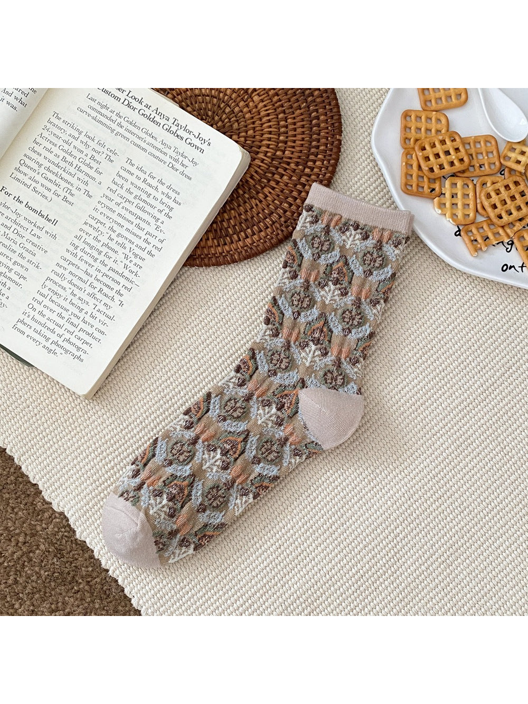 Khaki floral sock with a ribbed cuff and contrasting heel and toe panels.