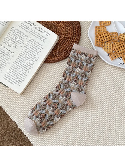 Khaki floral sock with a ribbed cuff and contrasting heel and toe panels.