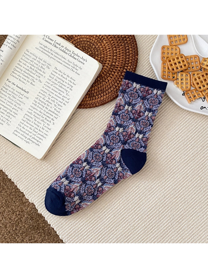 Navy floral sock with a ribbed cuff and contrasting heel and toe panels.