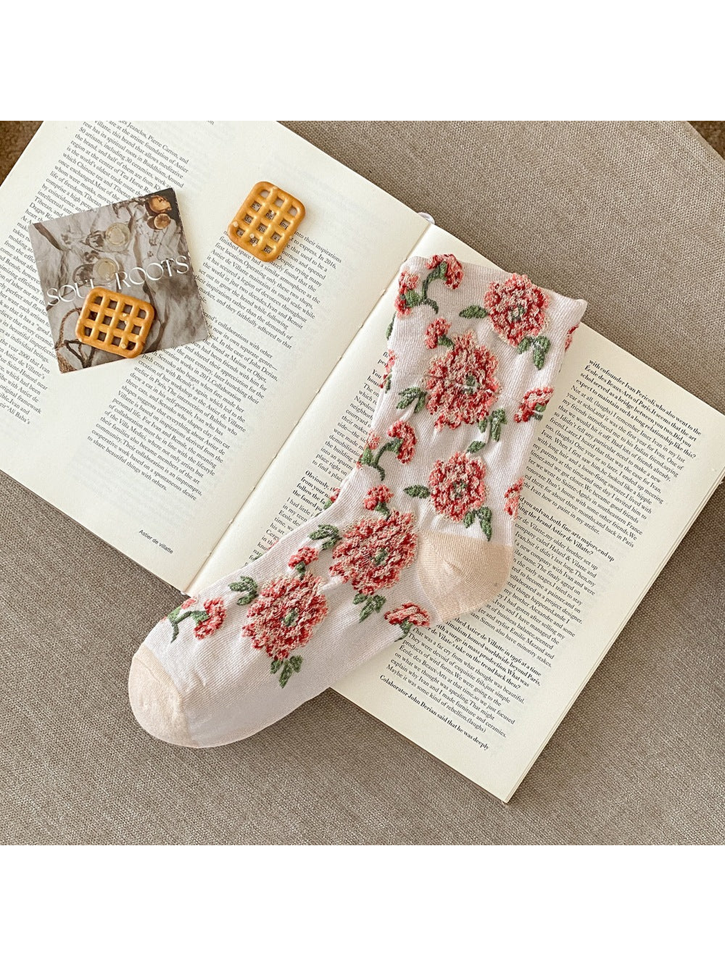 Ivory sock with raised red flowers, green leaves and plain toe and heel sections.