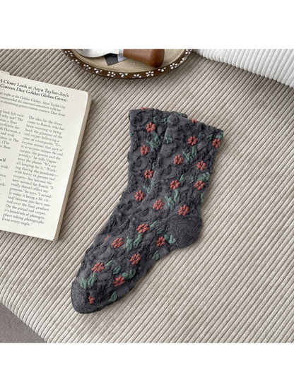 Dark Gray socks with coral flowers, green leaves and scalloped cuffs.