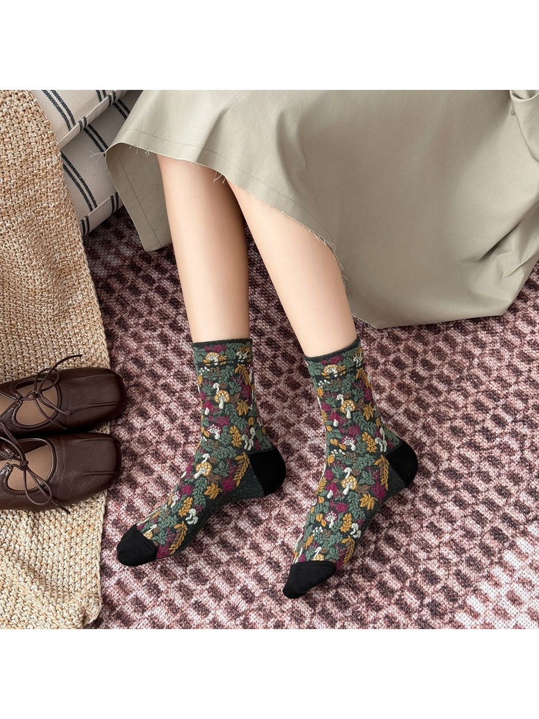 Black mushroom and foliage socks worn with the toes and heels visible.