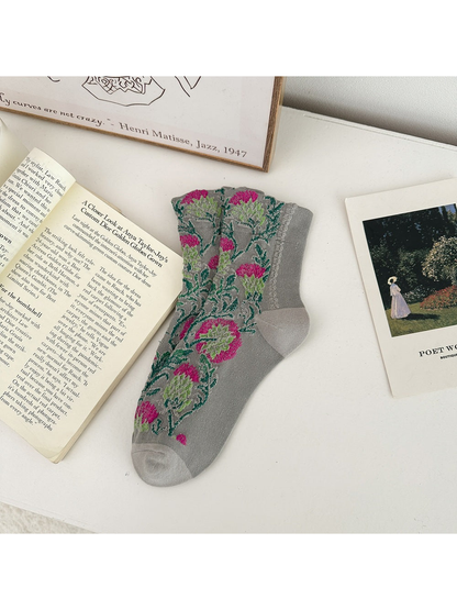 Light Gray floral sock laid flat with pink flowers and green leaves.