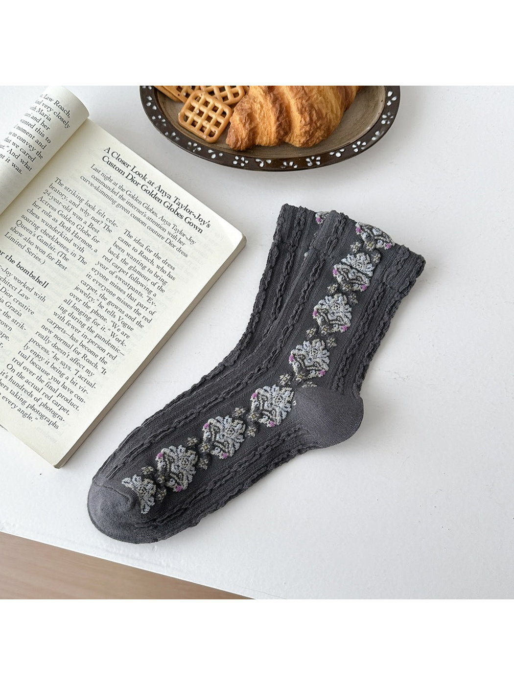 Dark Gray sock laid flat with repeating floral medallions and textured vertical ribbing.