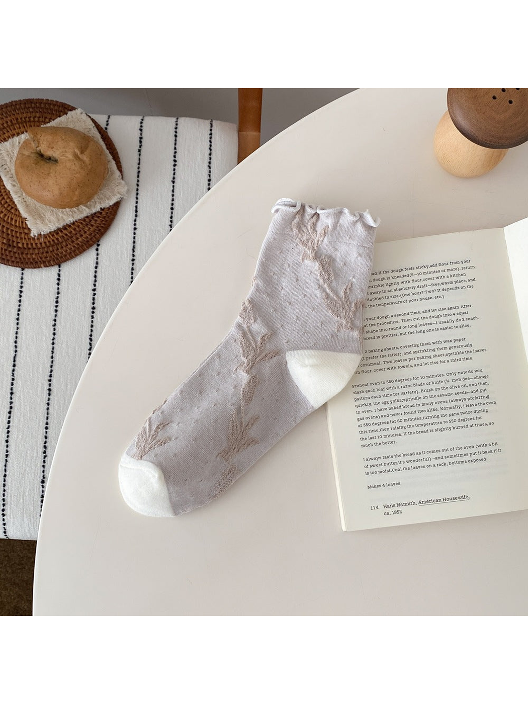 Ivory sock with floral vines, small dots, a ruffled cuff, and contrasting heel and toe panels.