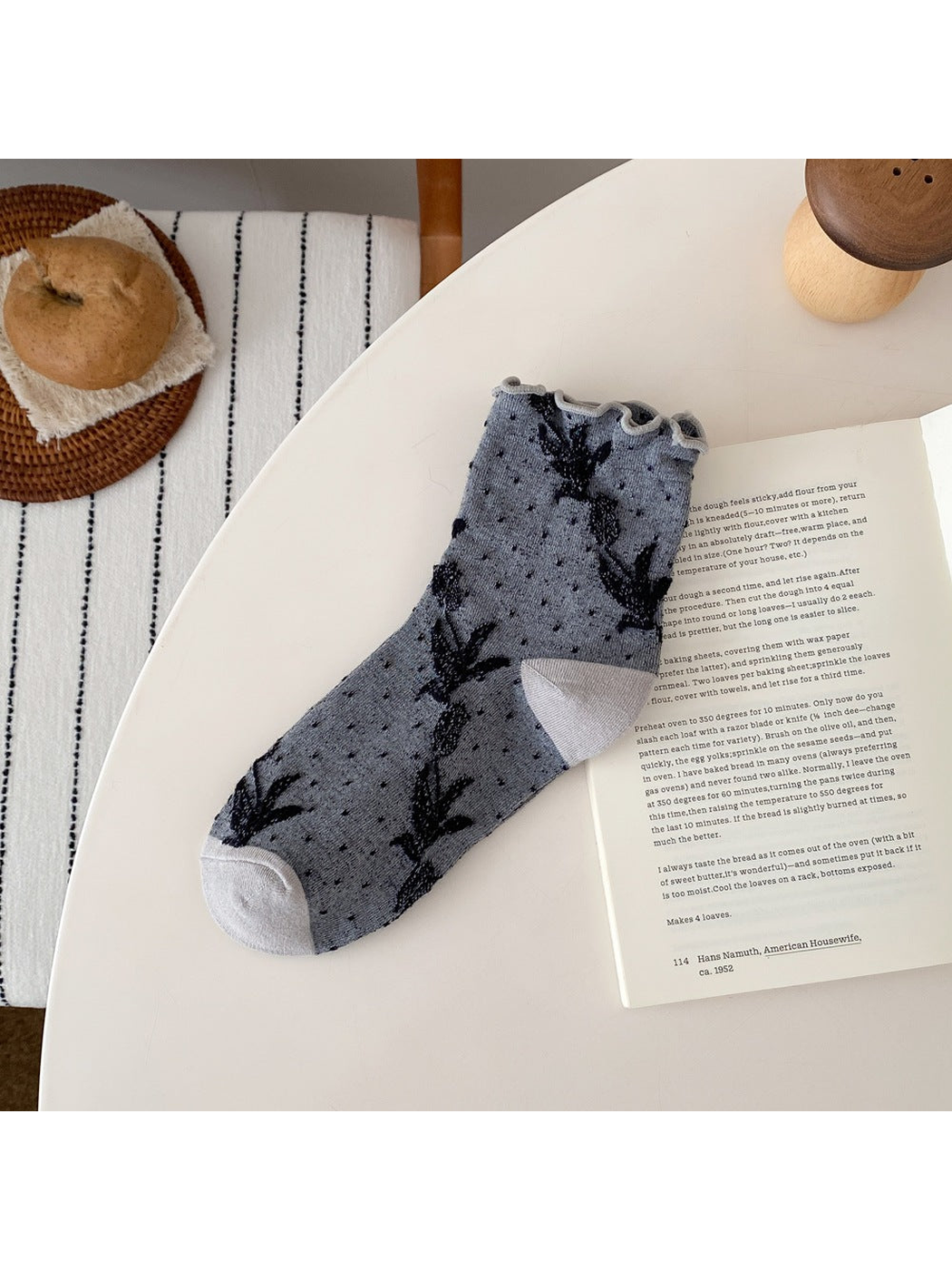 Light Gray sock with floral vines, small dots, a ruffled cuff, and contrasting heel and toe panels.