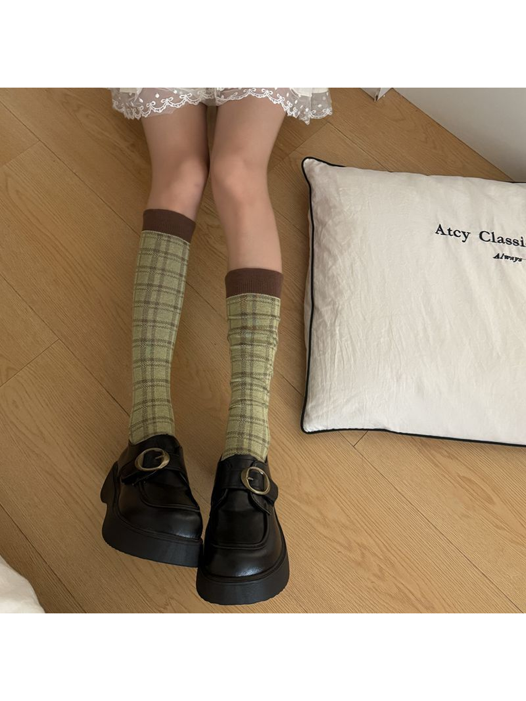 Army Green plaid socks with brown cuffs worn with black buckle shoes.