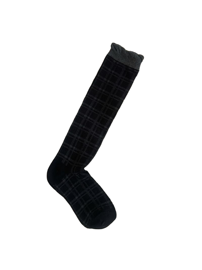 Black plaid sock laid flat with a contrasting gray ribbed cuff.