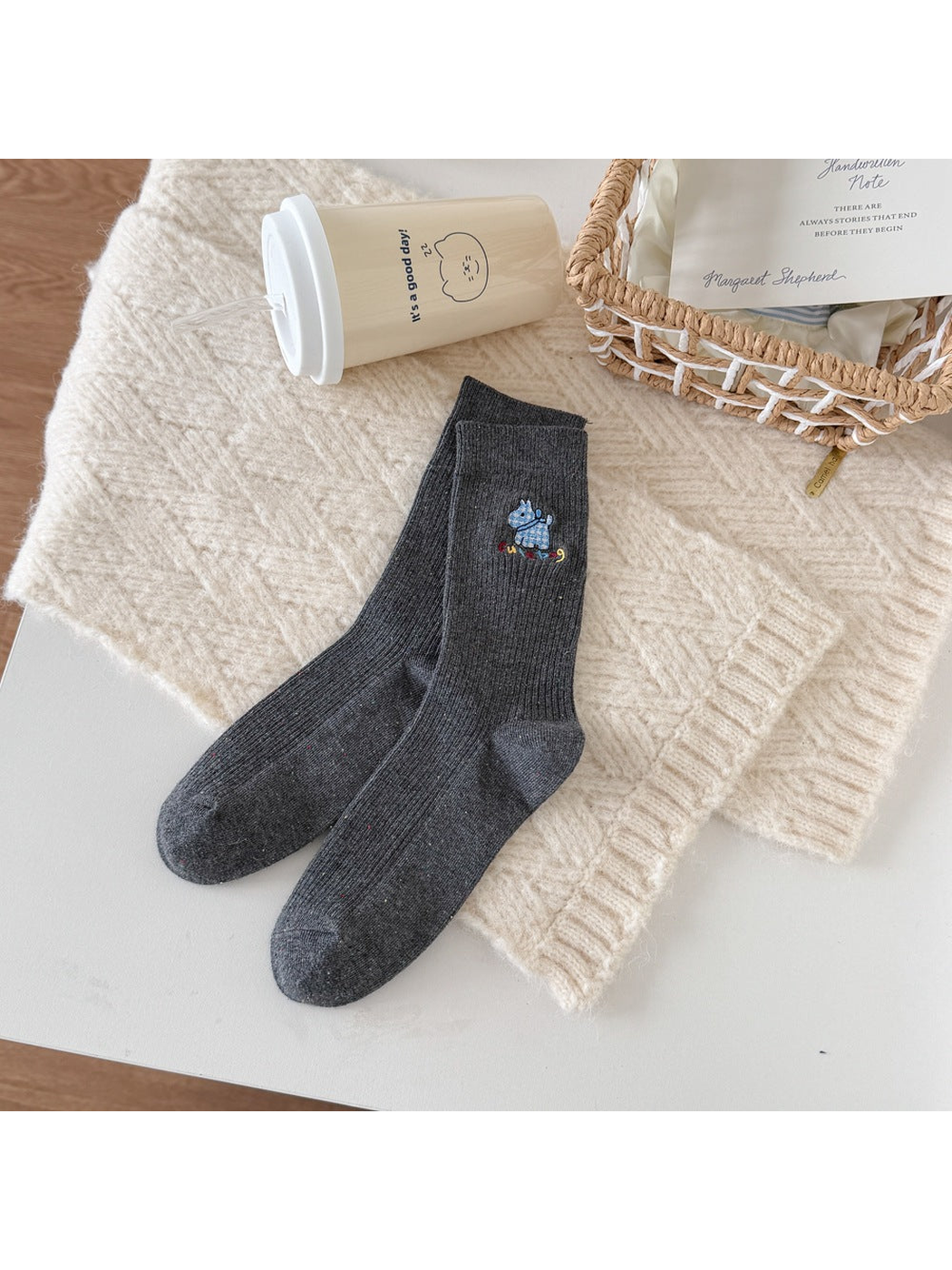 Dark Gray ribbed socks with a blue checked dog motif, multicolored lettering and flecks.