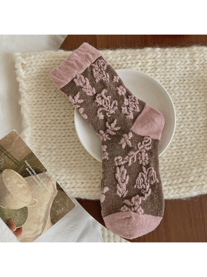 Pink floral sock with a brown body and contrasting pink cuff, heel and toe.