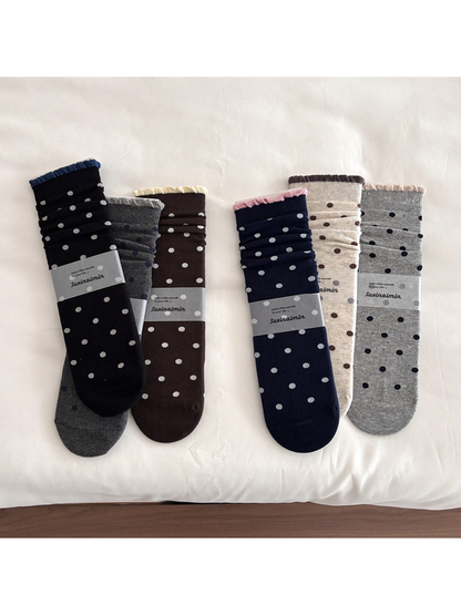 Polka dot socks in six colors with contrasting ruffled cuff edges.