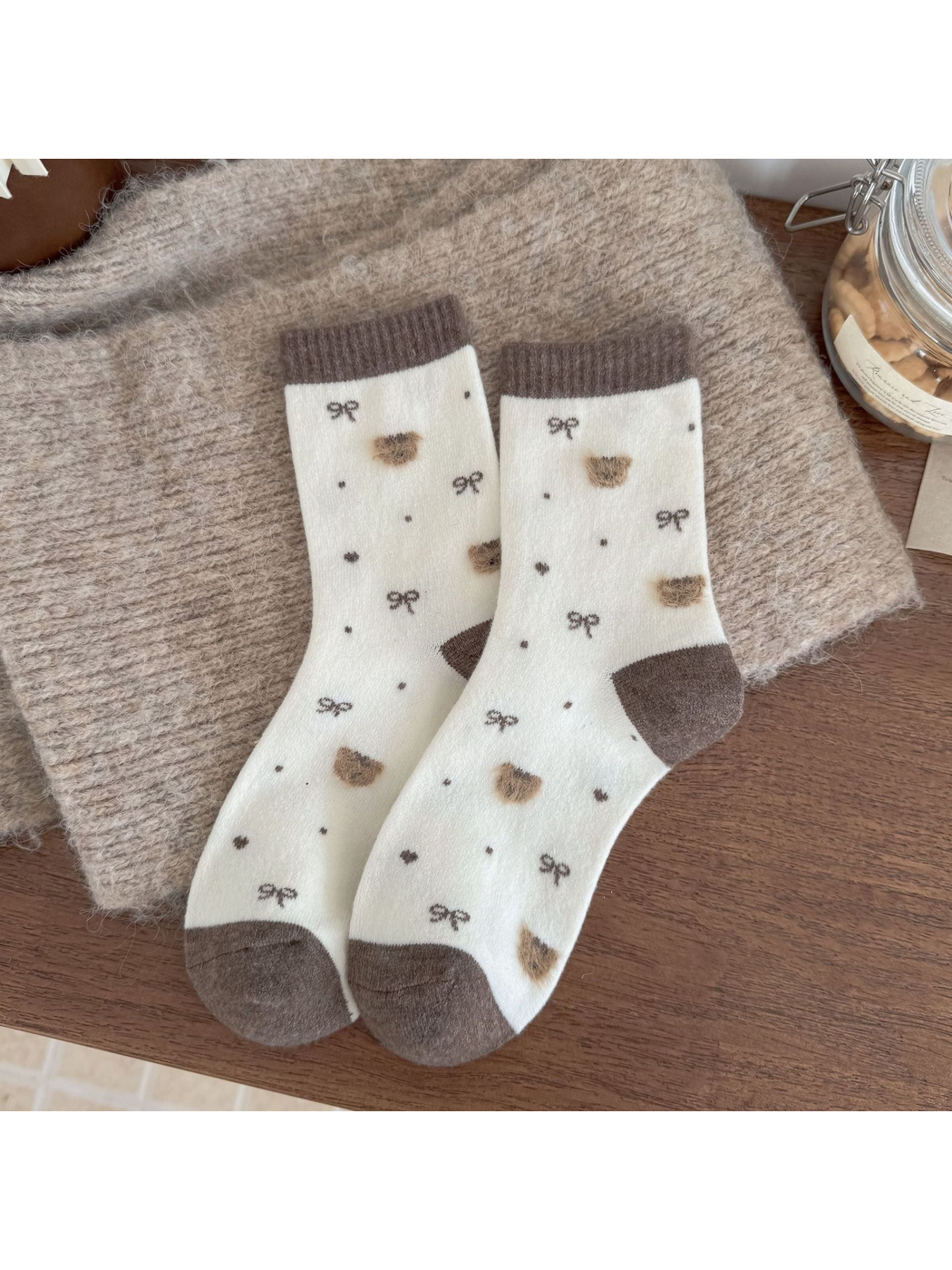 Ivory socks with brown cuffs, heels and toes, fuzzy bear heads, bows, dots and hearts.
