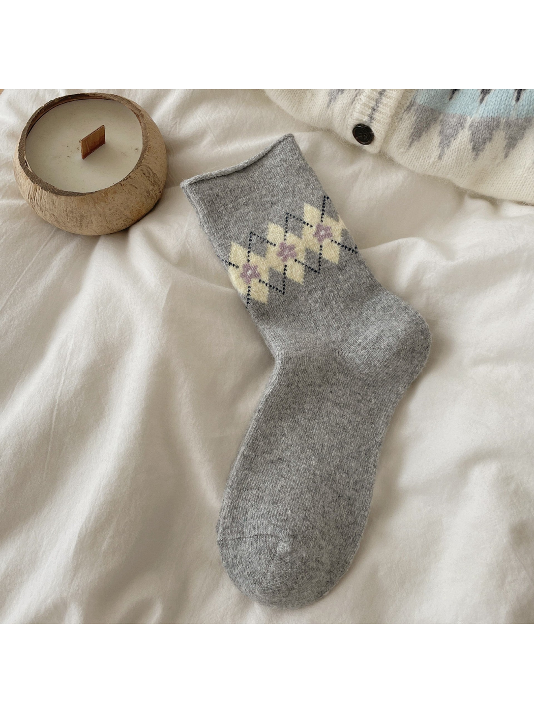 Heather Gray sock with pale yellow argyle diamonds, purple floral centers, and a rolled cuff.