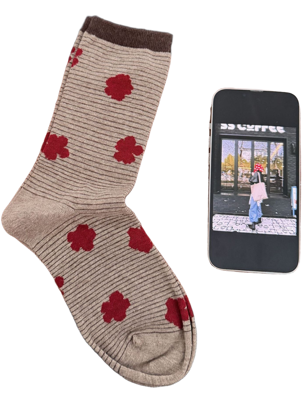 Beige sock with fine dark stripes, red flowers and a brown cuff.