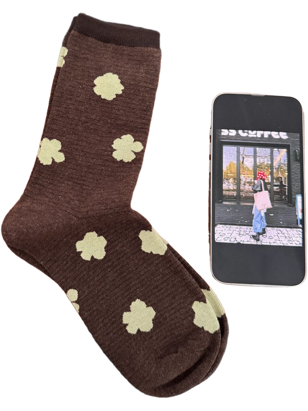Brown sock with pale yellow flowers and a darker brown cuff.
