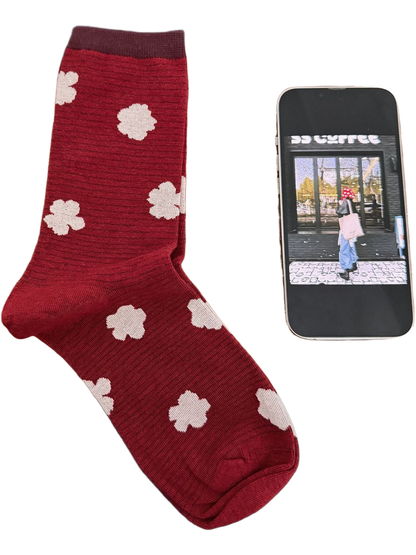 Burgundy sock with ivory flowers and a darker cuff.