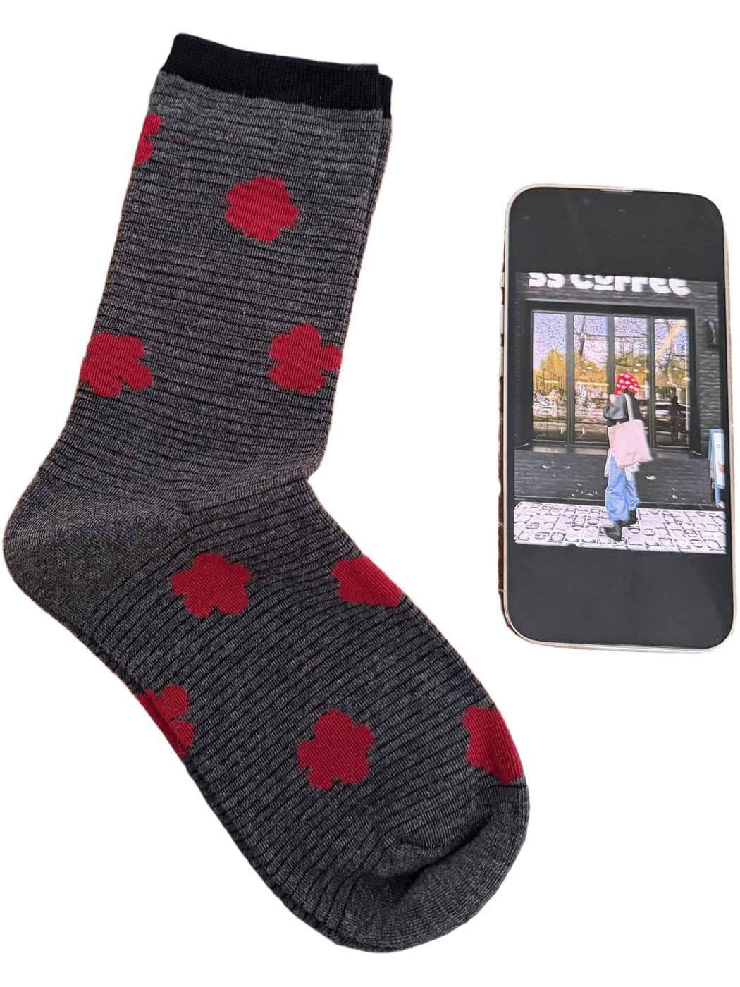 Gray sock with fine black stripes, red flowers and a black cuff.
