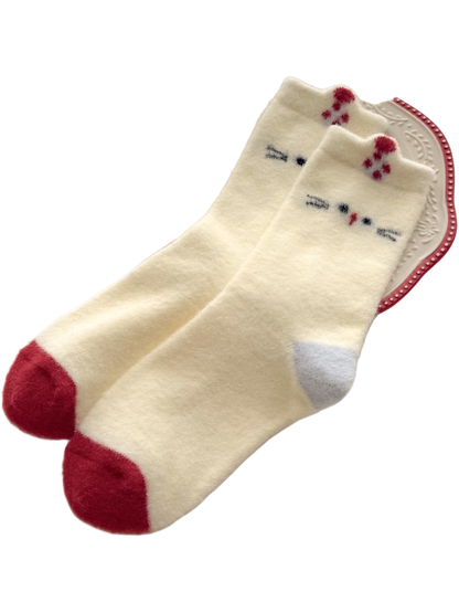 Cream Cat socks with cat faces, raised cuff tabs, red toes and light blue heels.