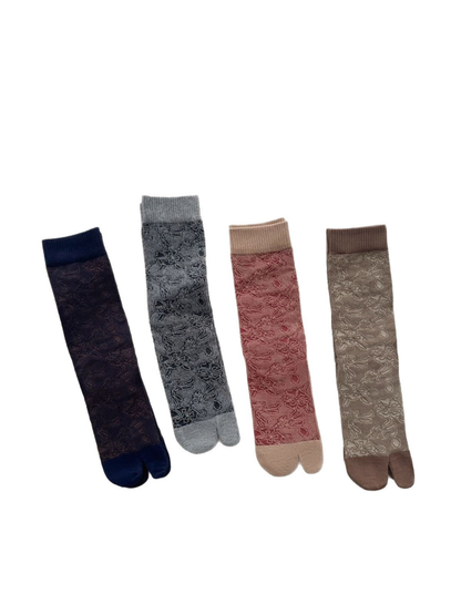 Four floral split-toe socks displayed in dark blue, gray, red, and brown colorways with ribbed cuffs.