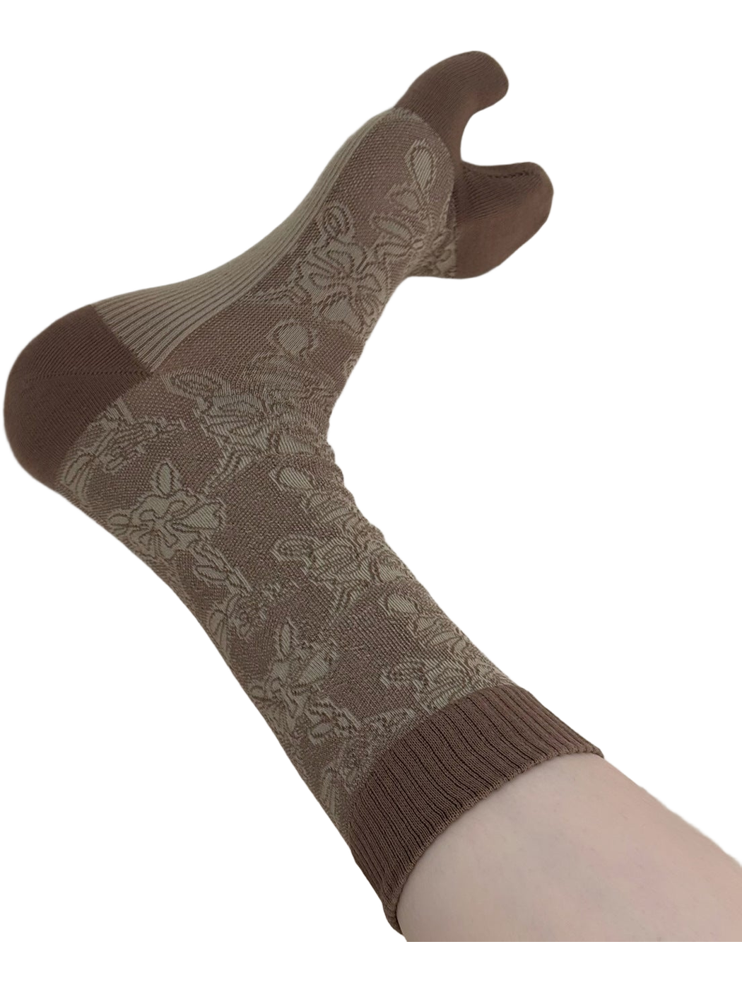 Close view of a brown-and-green floral split-toe sock with a ribbed cuff.