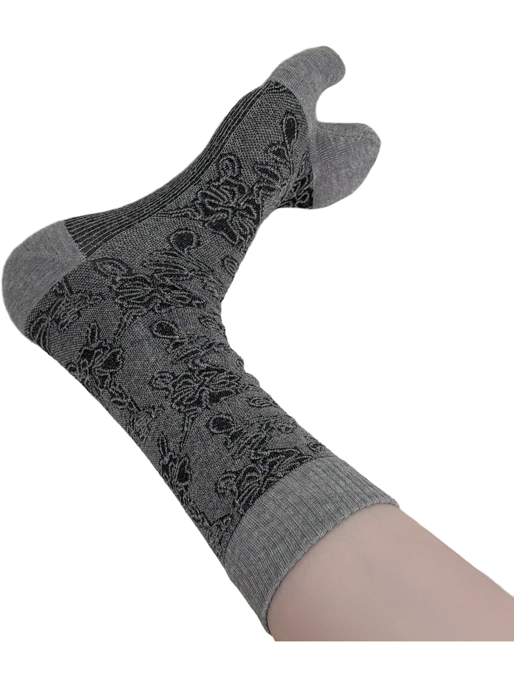 Close view of a black-and-gray floral split-toe sock with a ribbed cuff.