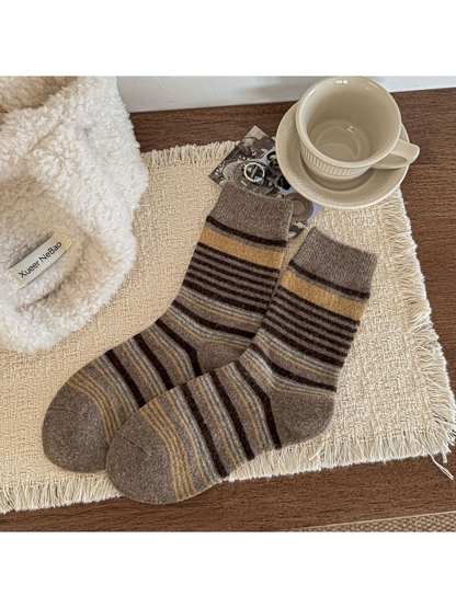 Greige striped crew socks with mustard-yellow bands and ribbed cuffs.